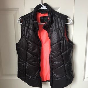 Black vest with pink inside